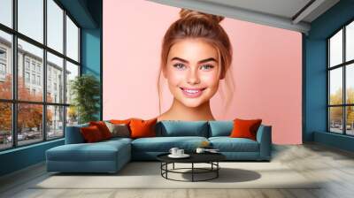 Portrait of smiling cheerful teenage girl with perfect skin, pink background, banner. Wall mural