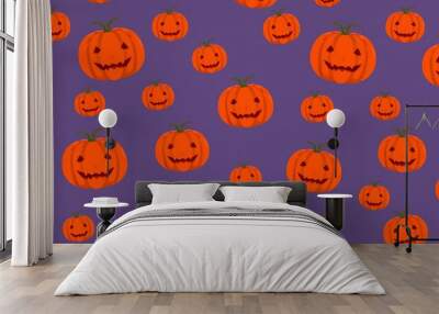 Orange jack-o'-lantern pumpkins on a purple background, a festive Halloween pattern for spooky celebrations. 
 Wall mural