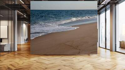 beautiful calm wave on a sandy beach Wall mural