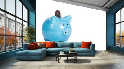 Blue piggy bank on white background. Copy space. Piggy bank and coin. Wall mural