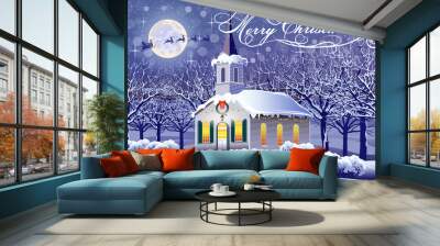 Night winter landscape with a festively decorated church and trees in the snow in the background. Wall mural