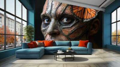  A man with a butterfly on his face and another on his head, against a black background Wall mural