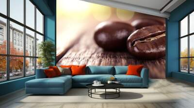  A tight shot of two coffee beans on a weathered table, sunlit through the lens, and a hazy background Wall mural