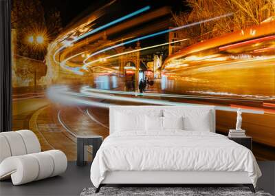 Night long exposure shot of two trams near the Mercado Central in Zaragoza, Spain Wall mural