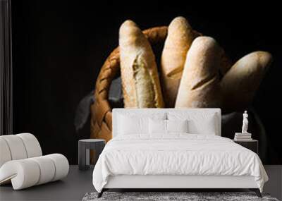 Fresh baguettes in wicker basket Wall mural