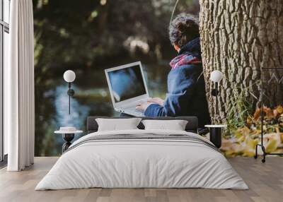 business women working with laptop in nature Wall mural