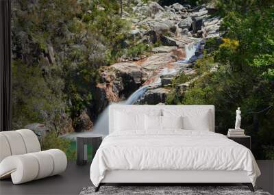 Waterfall and lake of portela do homem in Portugal on a spring sunny afernoon. Wall mural