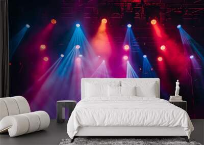 The stage of the concert is illuminated with colorful spotlights. Dark background, copy space concept. Wall mural