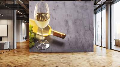 Glass of white wine on vintage wooden table Wall mural