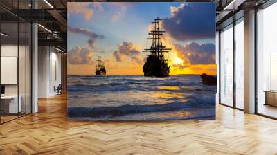 Pirate ship at the open sea at the sunset Wall mural