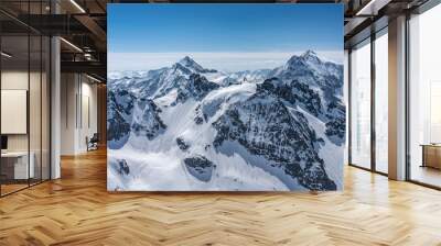 Switzerland, panorama view from Titlis mountain on Alps and mountains above white clouds Wall mural