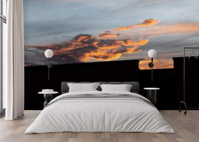 Stunning blue, yellow and orange summer sunset with residential unit black silhouette  Wall mural