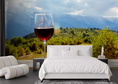 glass of wine in mountains Wall mural