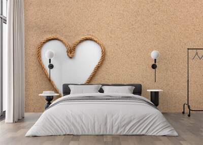 Heart made of rope with a white background on the sand Wall mural