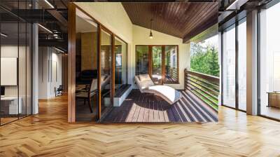 Modern wooden terrace in luxury cottage. Panorama windows. Soft lounge chair. Wall mural