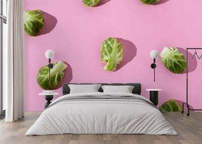 Colorful food pattern with broccoli on pink background. Healthy green food. Minimal vegetarians concept. Flat lay. Wall mural