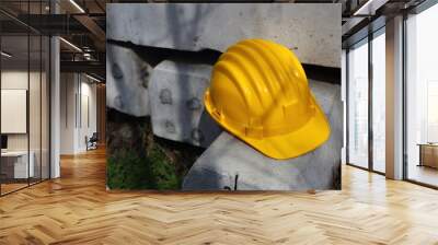 yellow helmet on a work site Wall mural