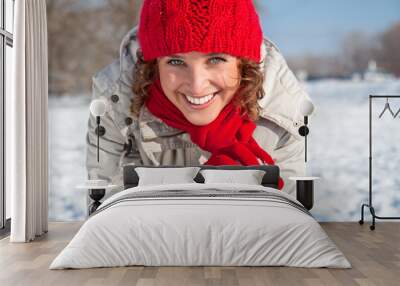 happy young woman playing snowball fight on the snow day Wall mural