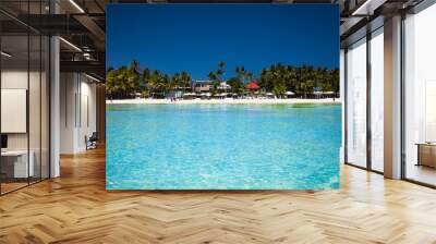 Tropical vacation on white sand beach with sun, blue sky and palm trees. White beach at Boracay, Philippines. Wall mural