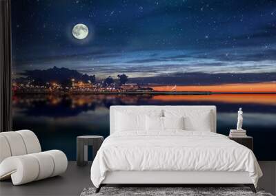  night sea water blurred city light,blue water wave  reflection  starry sky and moon in Italy  port harbor nature landscape Wall mural