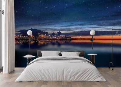  night sea water blurred city light,blue water wave  reflection  starry sky and moon in Italy  port harbor nature landscape Wall mural