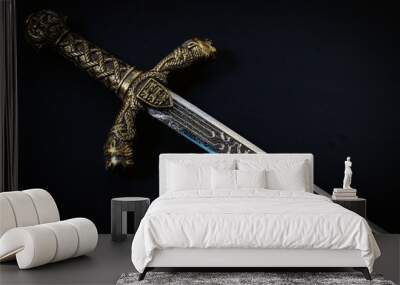 Knight sword on a black background Wall mural