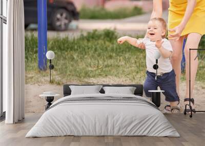 Baby's first steps on the street. Wall mural