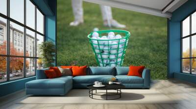 Full golf ball bucket on golf field Wall mural