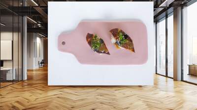 Japanese Sushi - Two Unagi Nigiri Sushi served on light pink board. Eel Sushi. Sushi pieces served on slate isolated on white background. Wall mural