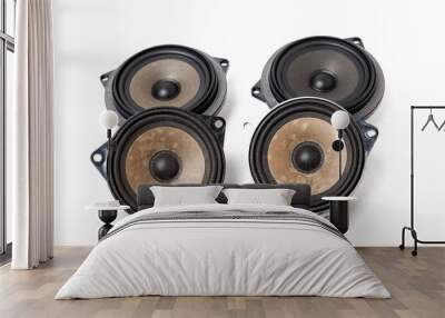 Four speakers of an acoustic system - an audio for playing music in a car interior on a white isolated background in a photo studio. Spare parts for auto repair in a workshop or for sale for tuning Wall mural