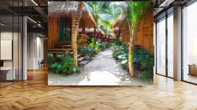 heavenly vacation on phi phi don island in thailand in a hotel with bamboo bungalow among palm trees Wall mural