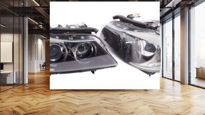 Stylish xenon headlight of a German car - optical equipment with a lamp inside on a white isolated background. Spare part for auto repair in a car workshop. Wall mural