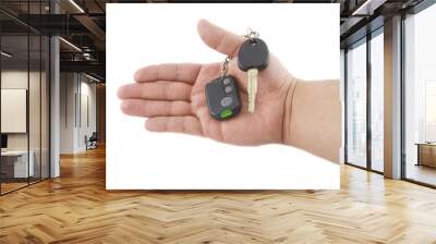 hand holding key and car alarm system isolated on white backgrou Wall mural