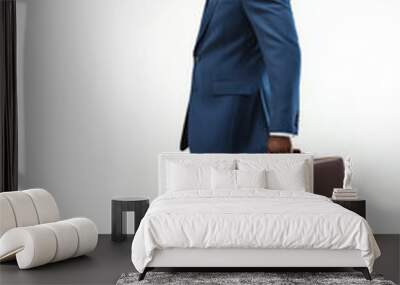 A man in a suit and tie is walking down a white background with a briefcase in his hand. Concept of professionalism and formality, as the man is dressed in a suit and tie and carrying a briefcase Wall mural