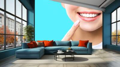 Perfect healthy teeth smile of a young woman. Teeth whitening. Dental clinic patient. Image symbolizes oral care dentistry, stomatology. blue Background Wall mural