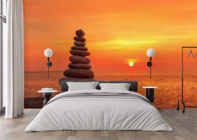 Concept of harmony and balance. Rock Zen on sunset background. Wall mural