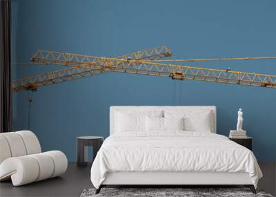 tower cranes at construction site and city background Wall mural