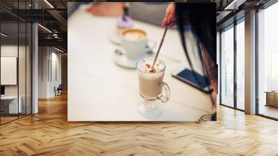 young couple in a cafe drinking coffee. closeup. Wall mural