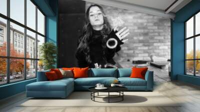 Vaping teenager. Young pretty white girl smoking an electronic cigarette  in vape bar. Bad habit. Black and white. Wall mural