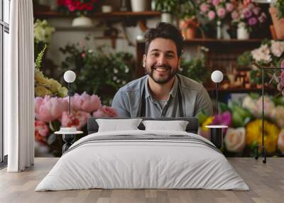 A portrait of a young male florist beaming with pride as he showcases his handcrafted floral arrangements in his quaint flower shop. Surrounded by vibrant blooms and lush greenery.
 Wall mural