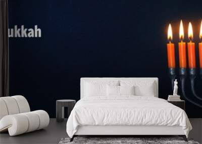 A serene banner featuring a menorah with all eight candles lit set against a deep blue background with subtle Star of David patterns The Happy Hanukkah message is in a beautiful script font with soft Wall mural