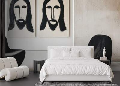 A sleek modern interior with white walls and minimalist furniture featuring two or three framed paintings of Jesus hanging in a row The neutral background highlights the art while the contemporary set Wall mural