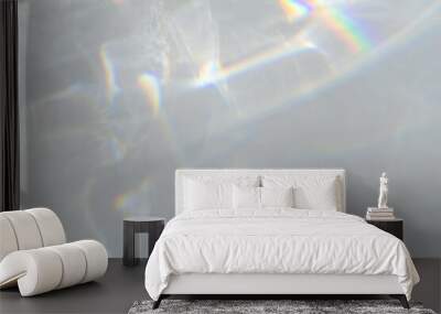  Crystal prism rainbow light refraction texture on white wall background. Organic drop diagonal holographic flare on a white wall. Water shadows for natural light overlay effects Wall mural