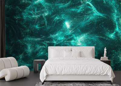 Abstract elegant, detailed mint glitter particles flow with shallow depth of field underwater. Holiday magic shimmering luxury background. Festive sparkles and lights. de-focused. Wall mural