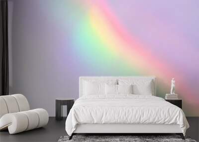 Abstract holographic retro rainbow light refraction texture overlay. Organic drop diagonal holographic flare on a white wall background. Natural shadows and light effect Wall mural