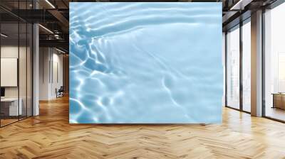 Blurred transparent blue colored clear calm water surface texture with splashes and bubbles. Trendy abstract nature background. Water waves in sunlight with copy space. Wall mural