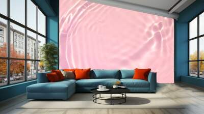 de-focused. Closeup of pink transparent clear calm water surface texture with splashes and bubbles. Trendy abstract summer nature background. Coral colored waves in sunlight. Wall mural