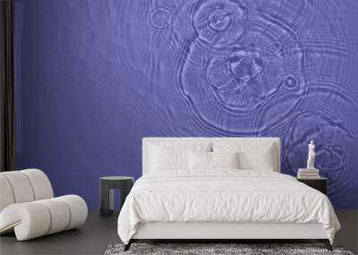 Transparent purple water surface texture with ripples, splashes and bubbles. Abstract nature background Water waves in sunlight with copy space Cosmetic moisturizer micellar toner emulsion. 2022 color Wall mural