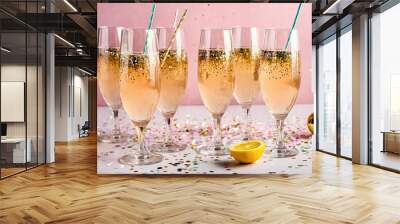 Sparkling drinks on a festive table, ready for a celebratory toast. Wall mural