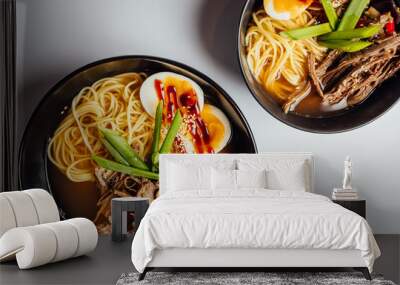 Two fresh and tasty Japanese ramen soup with beef, egg, noodles and sprout on bright  background... Wall mural